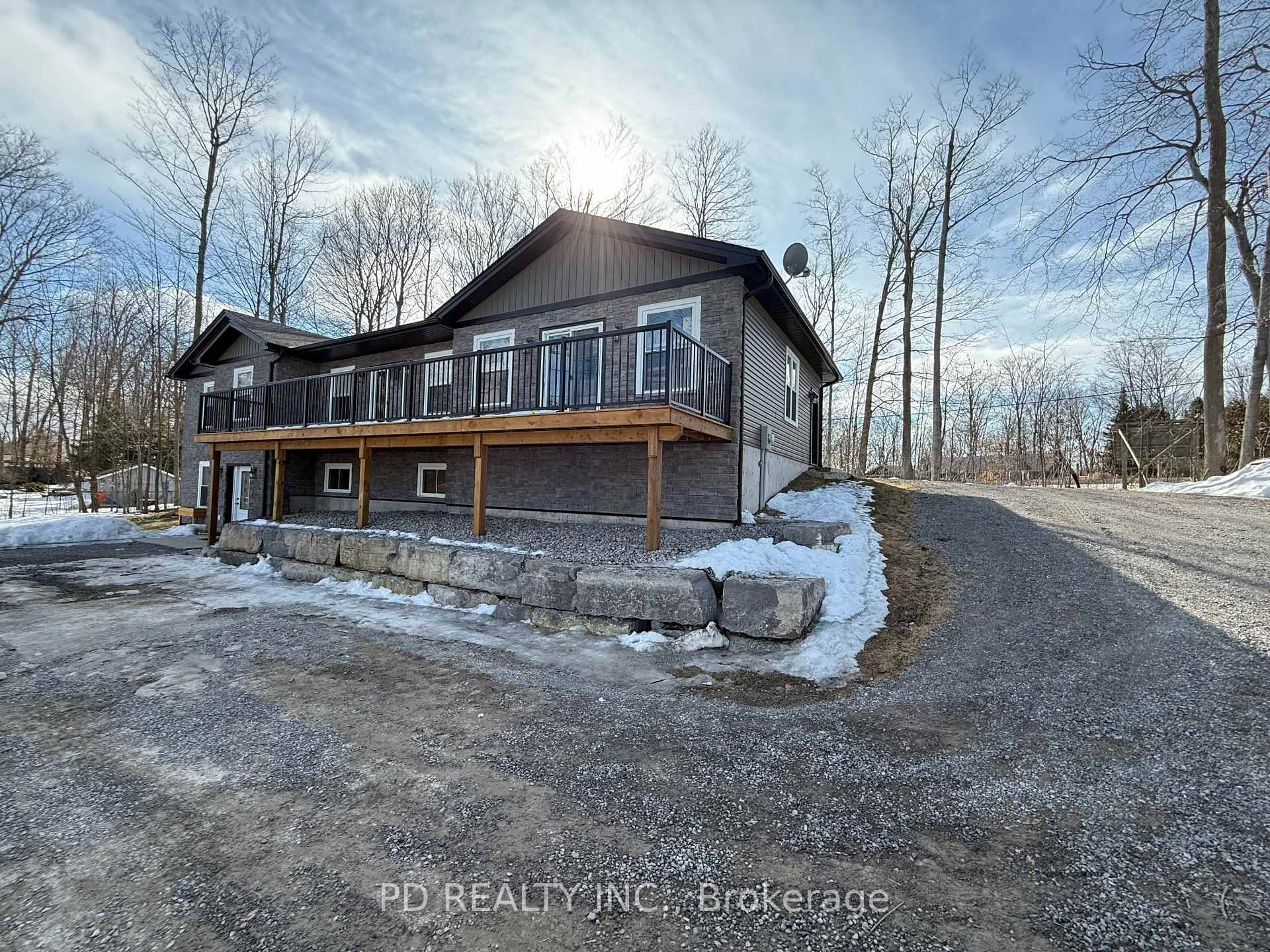 Stunning 3 2 bedroom, 3 bathroom, 2 kitchen bungalow on a treed 1 acre lot.