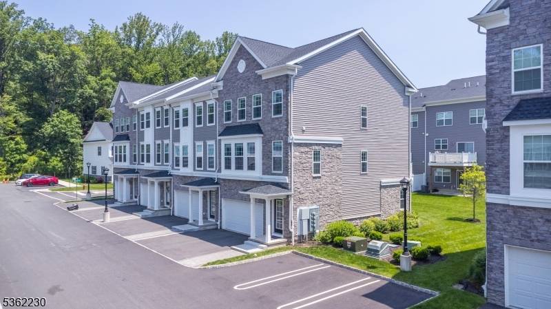Stunning End Unit Townhome with Designer Upgrades Smart Home Features !