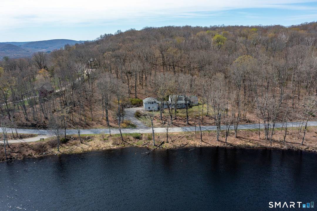 Perched on seven private acres above Beaman Pond, this three bedroom Colonial sits across from the East Kent Hamlet Nature Preserve.