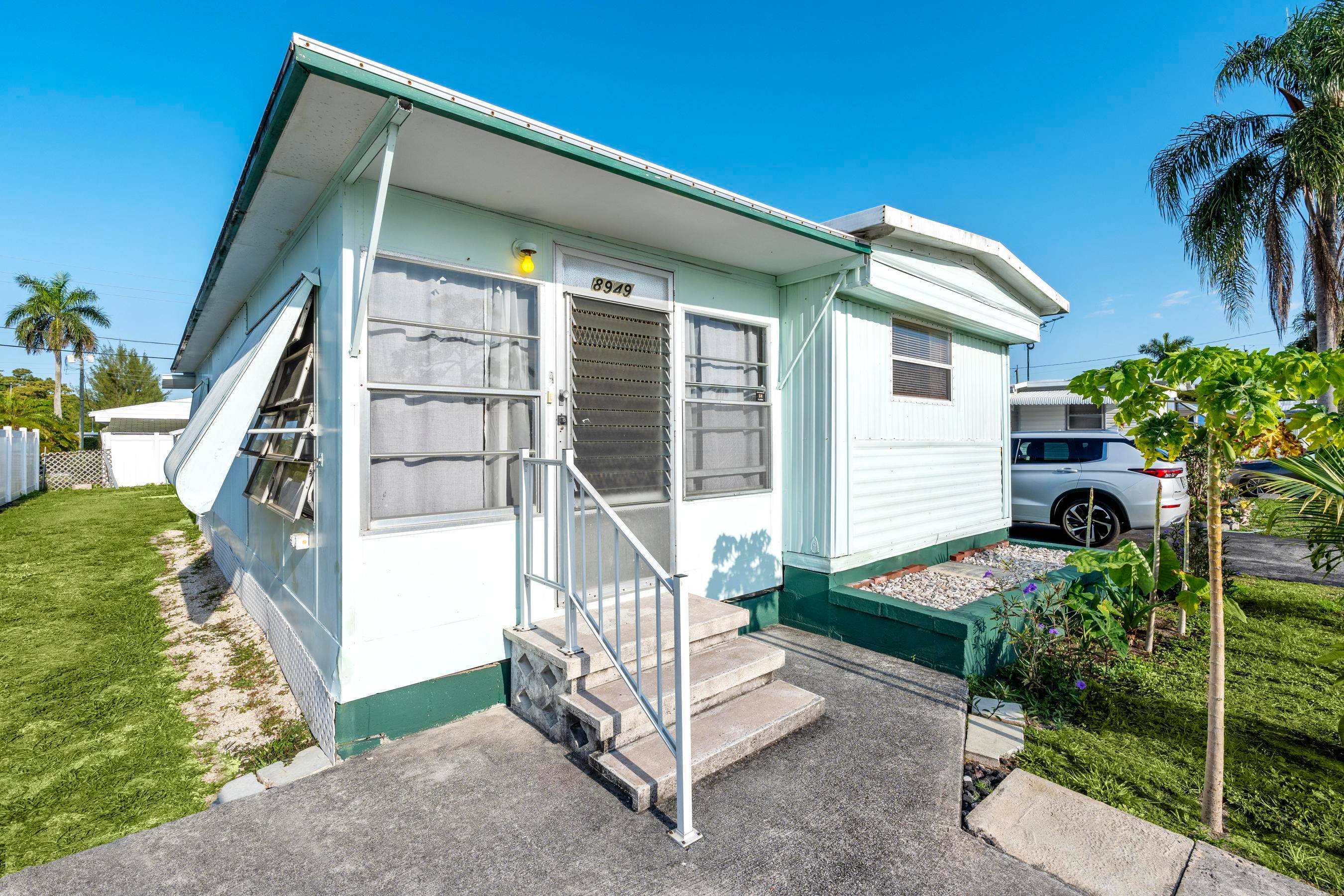 Welcome to 8489 Oak Street in Boynton Beach a charming and budget friendly manufactured home located in a quiet, well maintained 55 community, where all residents must meet the age ...