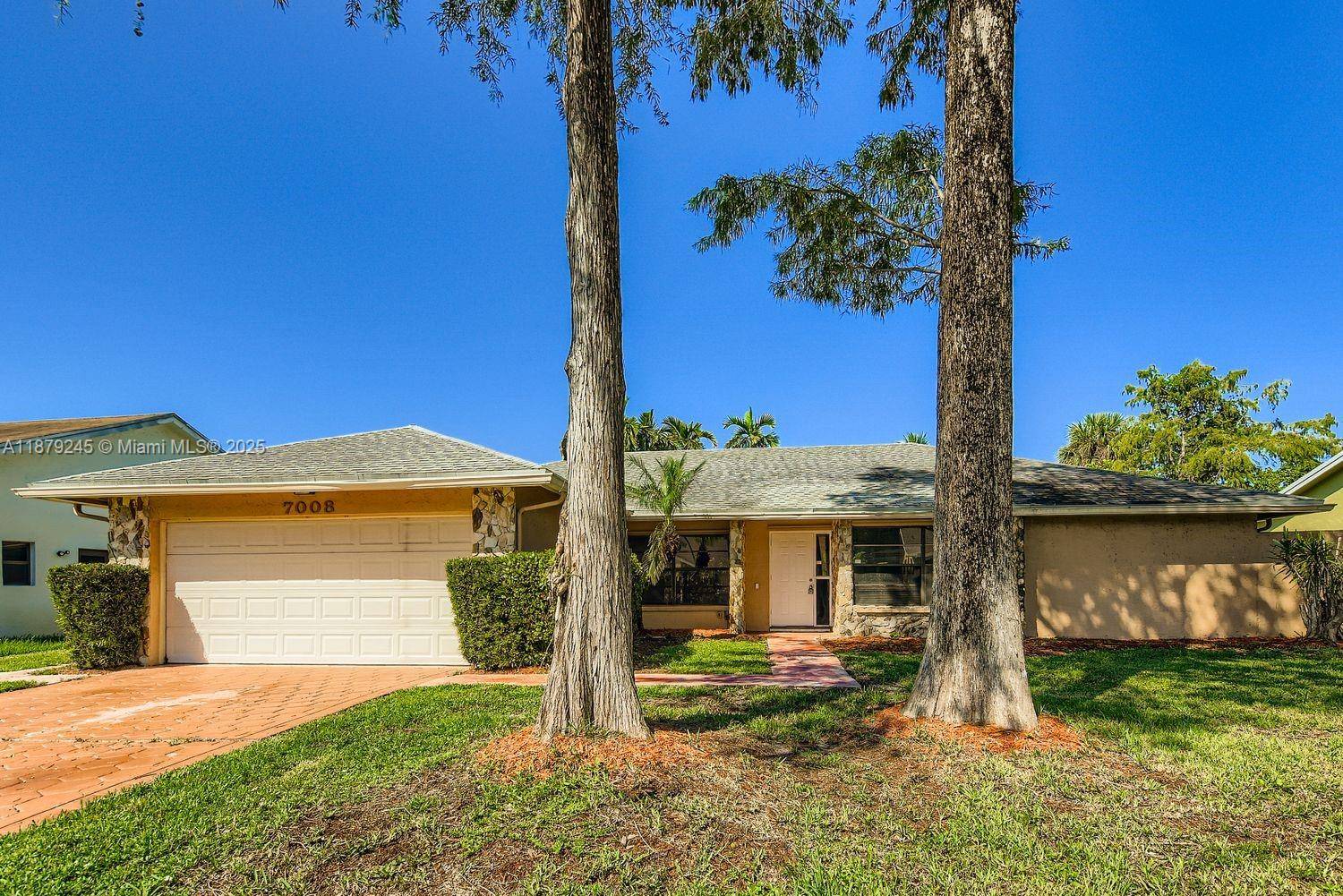 This corner lot home features a 3 2 layout with a two car garage and a fully screened porch for year round enjoyment.