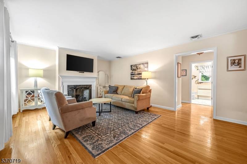 Discover this immaculate 3 bedroom, 2 bath ranch with a versatile in law suite with a separate entrance.