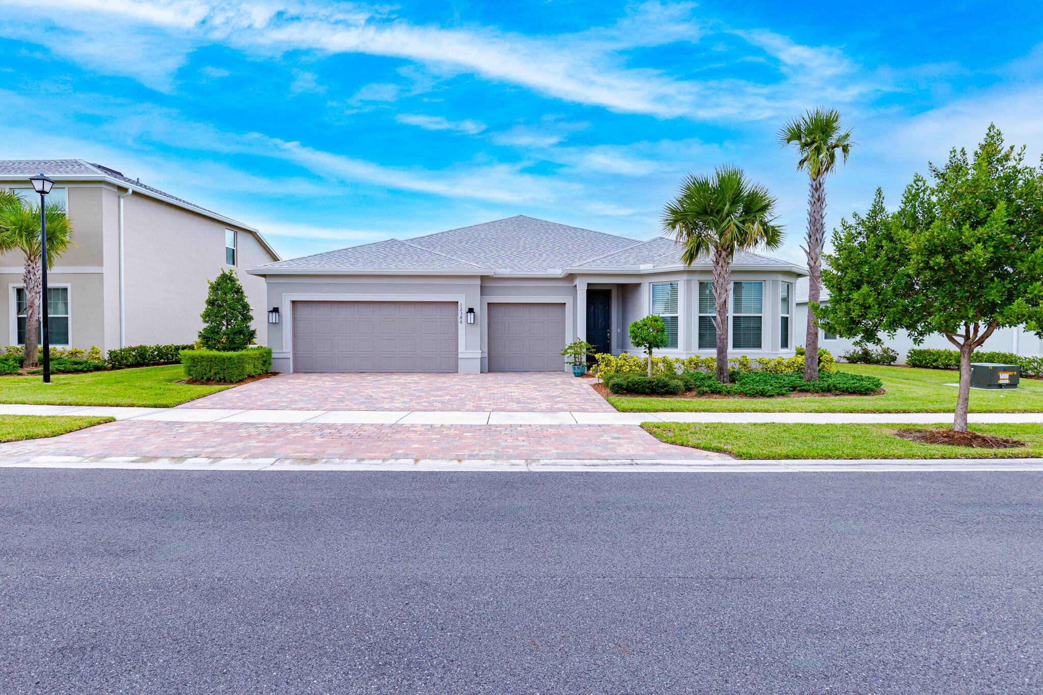 NEW TO MARKET ! Stunning 3 bedroom den, 3 bath home with 3 car garage in the sought after gated community of Heron Preserve at Tradition.
