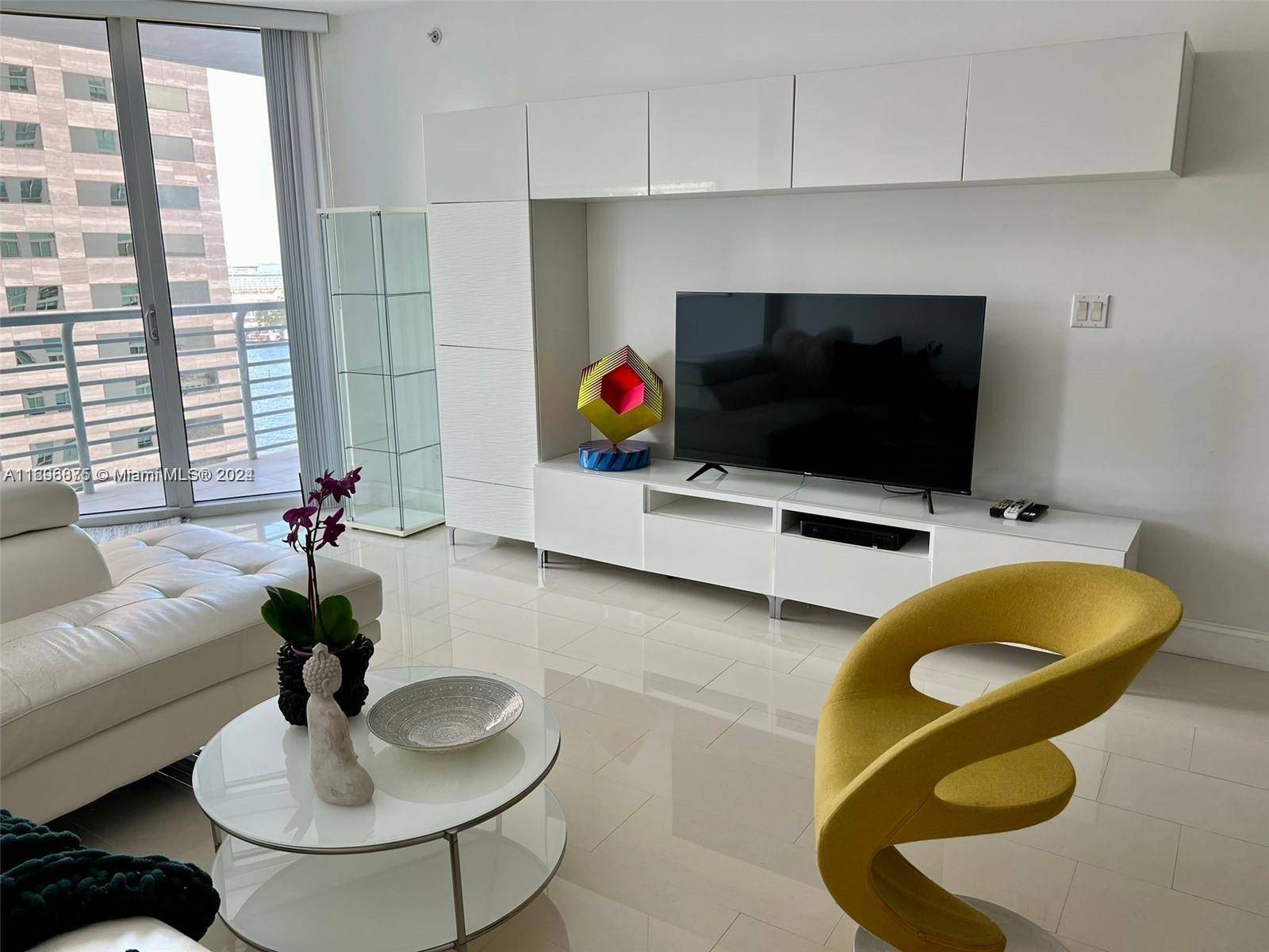 Welcome to waterfront living at One Miami East, a premier residence in Downtown Miami.