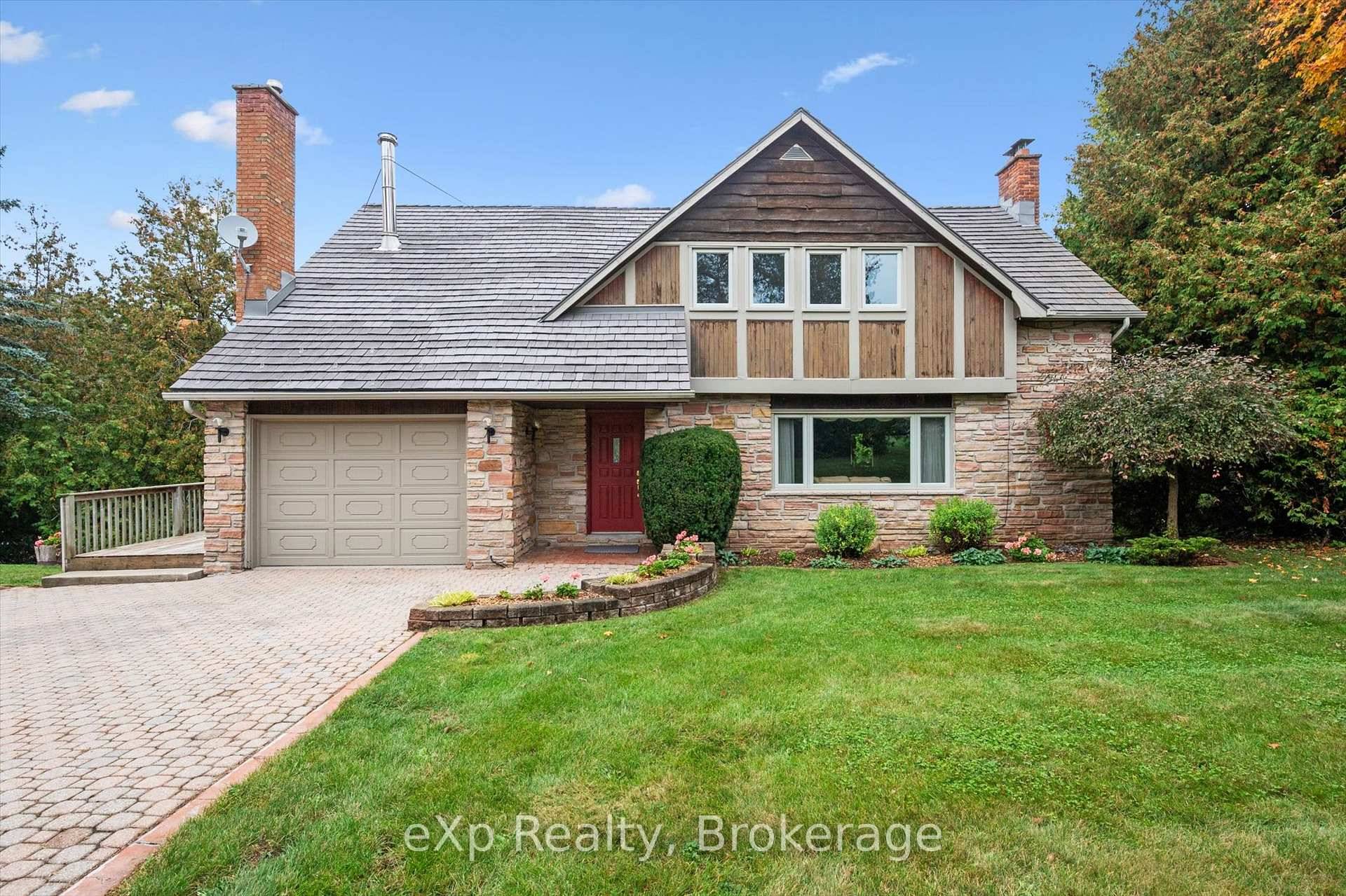 Lovely and private, this 2 acre property with a forested backdrop is nestled in a peaceful rural type setting on the edge of Guelph.