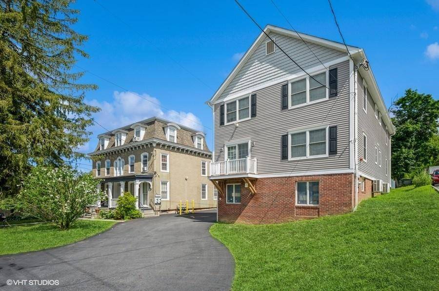 Welcome to this beautifully modern two family home, where comfort meets convenience in every detail.