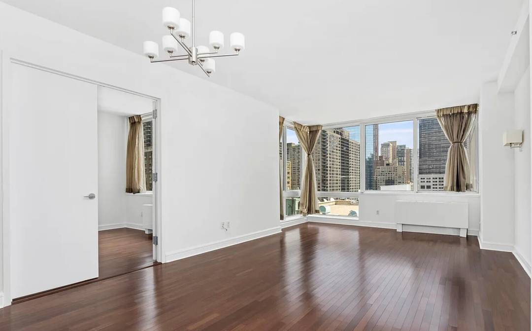 Unit 16J is a spectacular corner residence offering sweeping city views to the east and north.