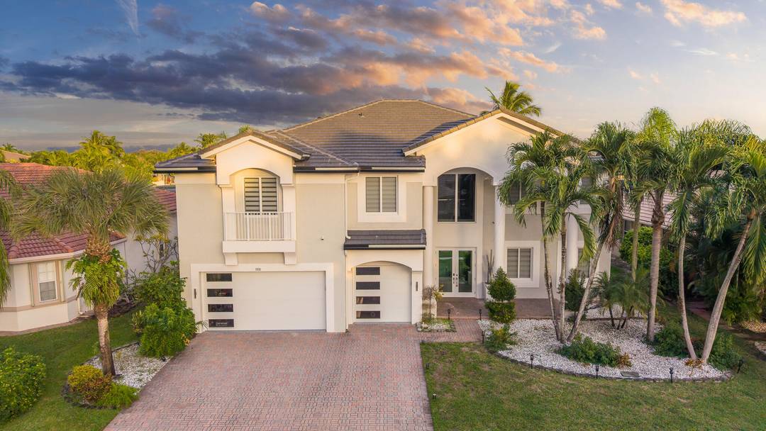 Luxury lakefront residence featuring 5 bedrooms, a loft, and 4 full baths.
