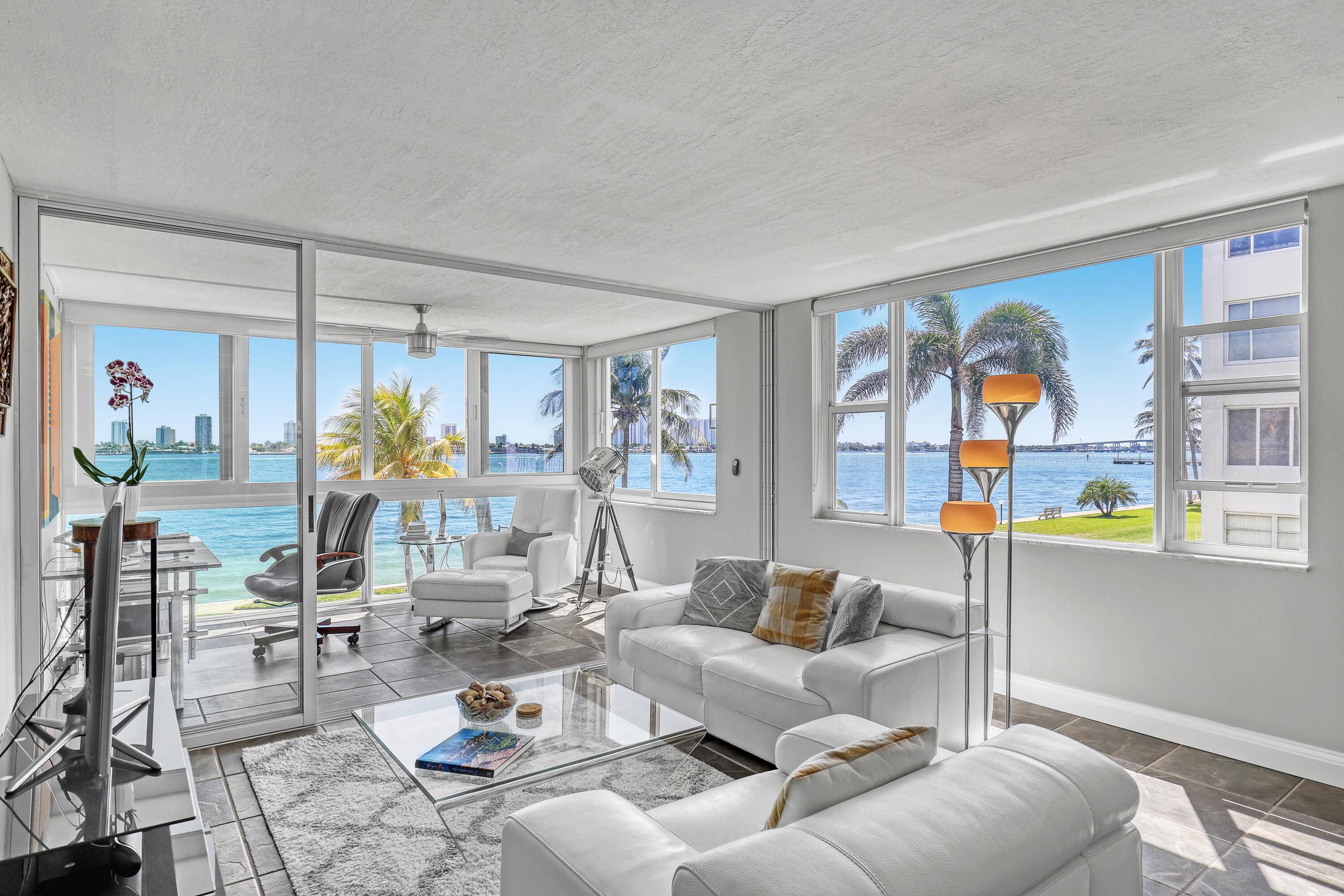 Enjoy Stunning Vistas of Lake Worth on the Intracoastal, Sunsets Sunrises from this rarely available southeast corner waterfront condo.