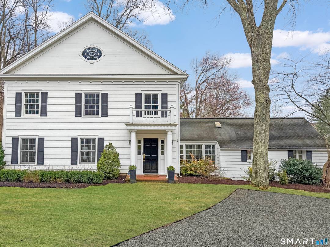 A gated entry introduces this stunning Federal style Colonial, privately set on just over 2 acres.