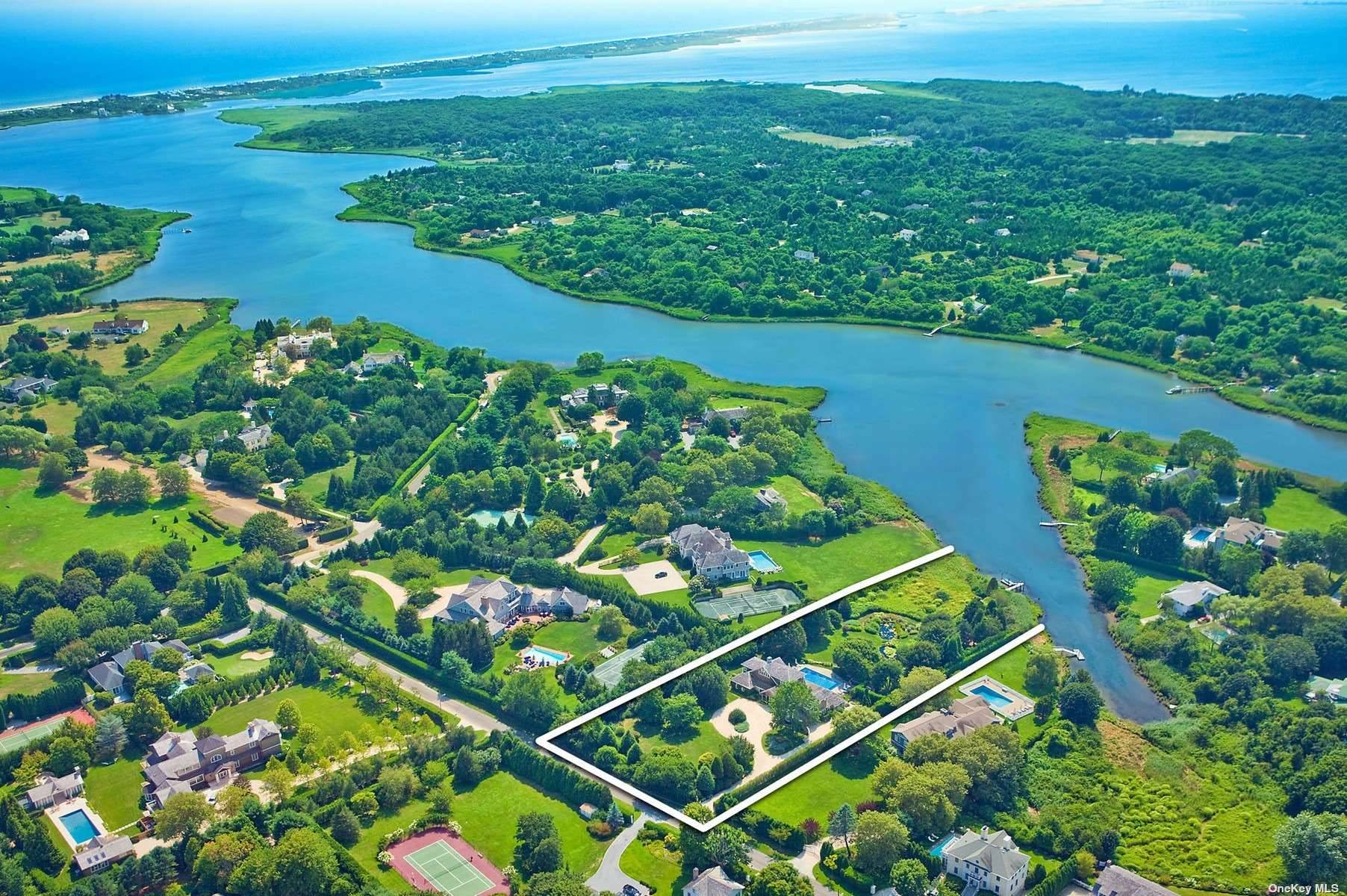 This park like beauty has private and serene water views from these eight bedrooms, eight and one half bath traditional residence, which includes a first floor master bedroom.