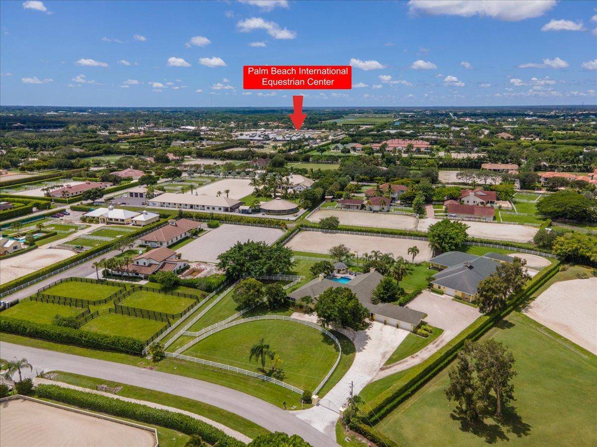 Exceptional 5 bedroom pool home located just a 1 4 mile walk or golf cart ride from the entrance of Wellington International.