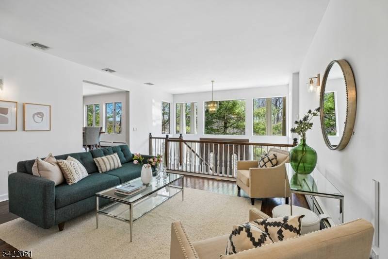 Welcome to this light filled, design forward home in the highly sought after High Crest Lake community.