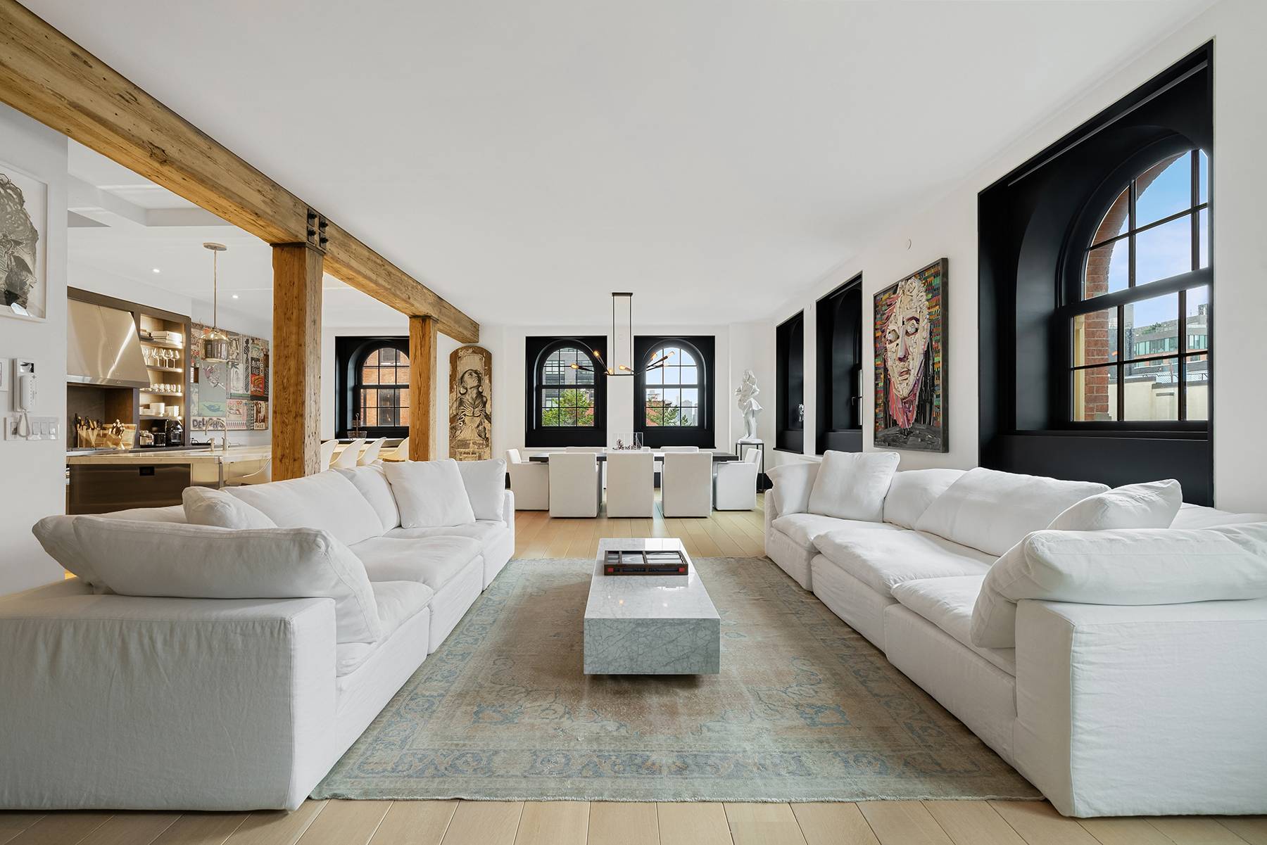 This four bedroom, four and a half bathroom, loft style apartment combines a bright and modern design scheme with understated yet distinctive original details.