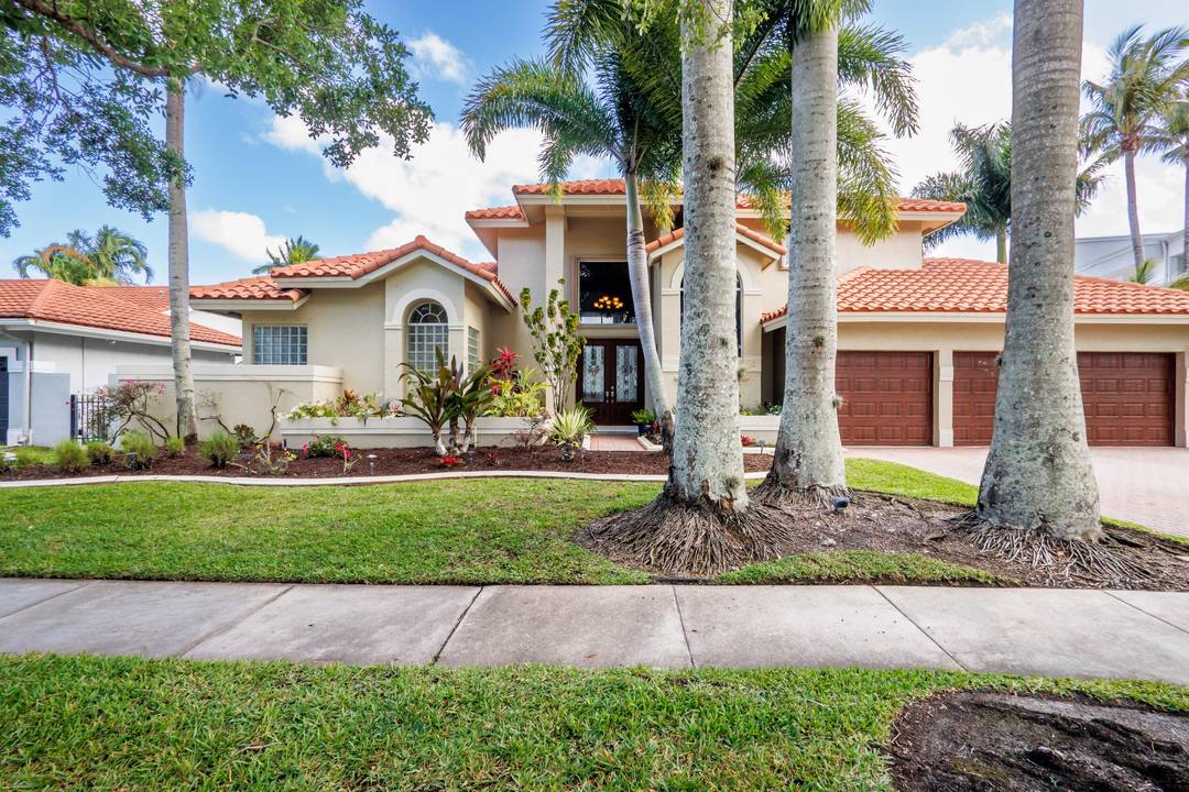 STUNNING IMMACULATE SINGLE FAMILY HOME WITH INCREDIBLE LARGE LAKE VIEW AND CUSTOM POOL.