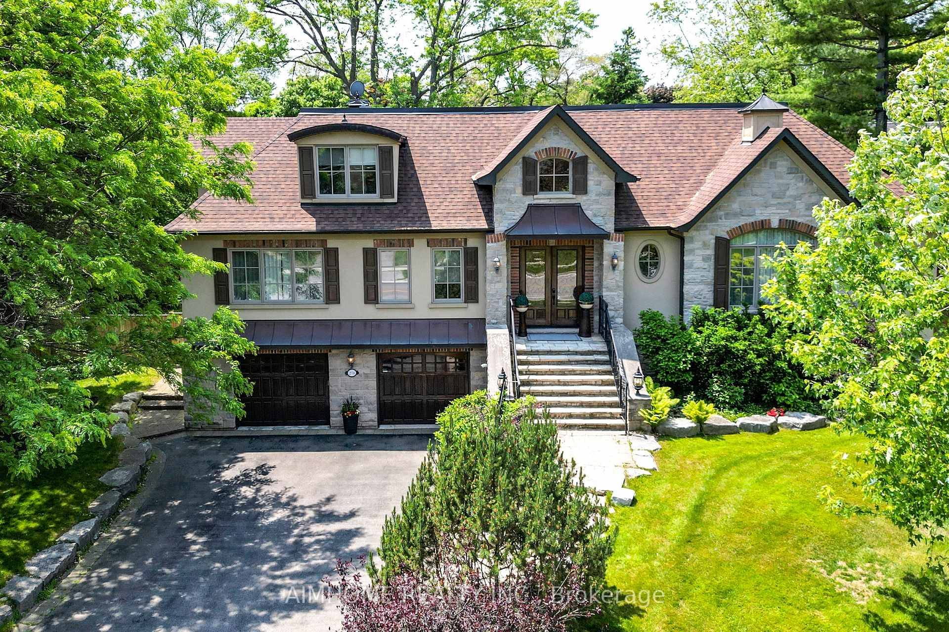 Quality custom built raised bungaloft with elevator, set on a beautifully landscaped lot.