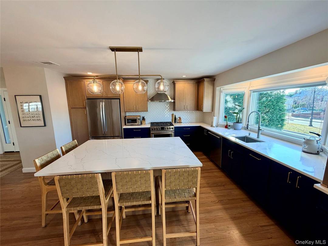 Welcome to this stunning beachside home beautifully renovated from top to bottom and designed for effortless coastal living.