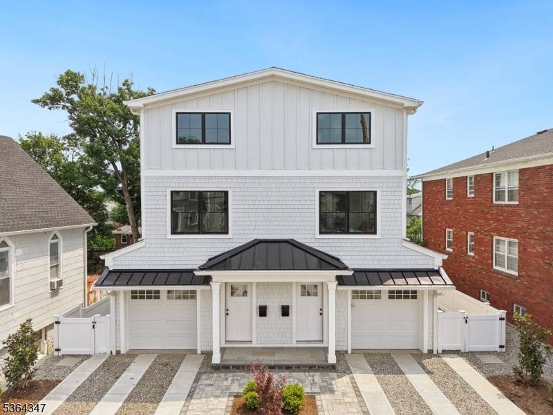 Discover the perfect blend of city convenience and suburban charm in this exceptional new construction townhome just 2 blocks from downtown Millburn.