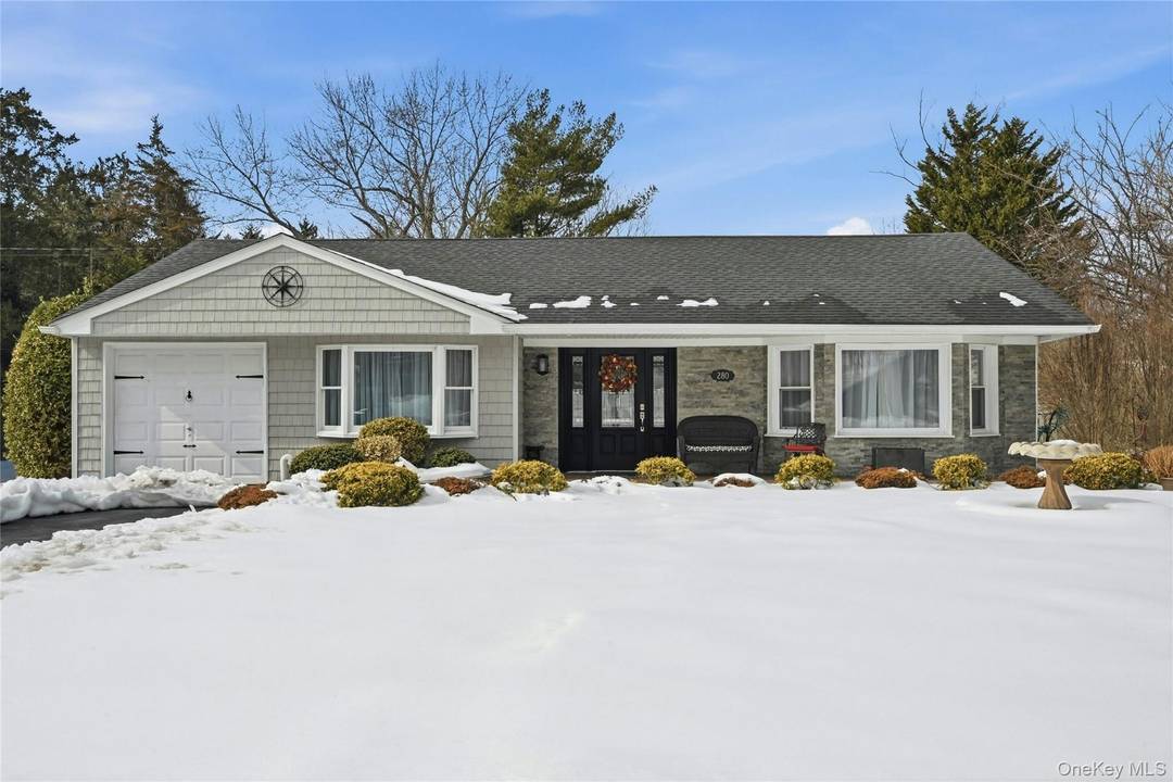 Smithtown School District Welcome to this beautifully renovated Split Ranch offering 4 bedrooms and 1.