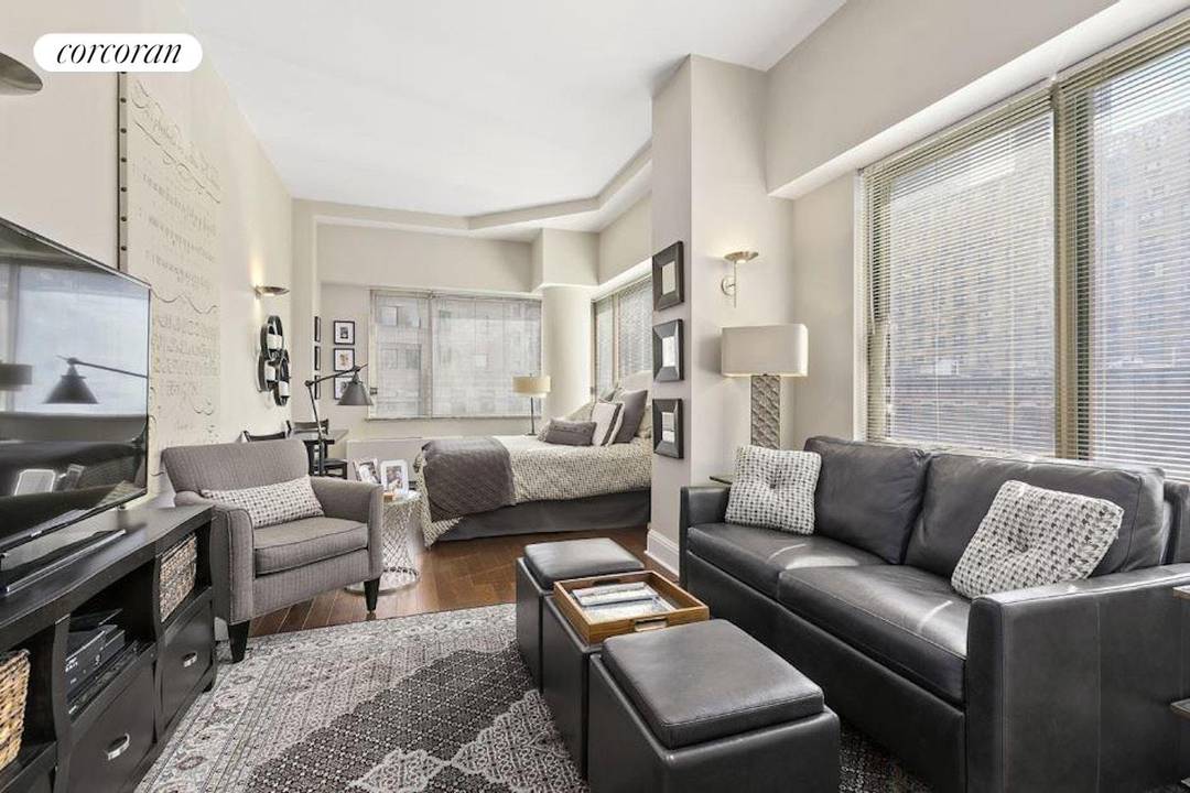 Residence 6K at 350 West 50th Street is an extraordinary loft like sunny corner, mint renovated studio with soaring high ceilings, eight over sized window panels facing East and South, ...