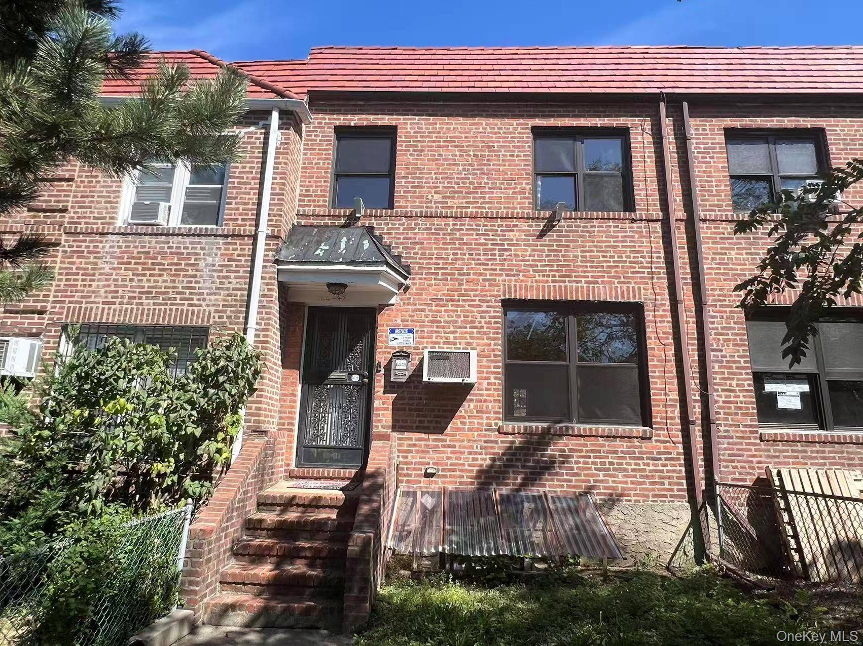 Welcome to this beautiful bright Updated Solid brick attached ONE family home in prime Rego Park location.