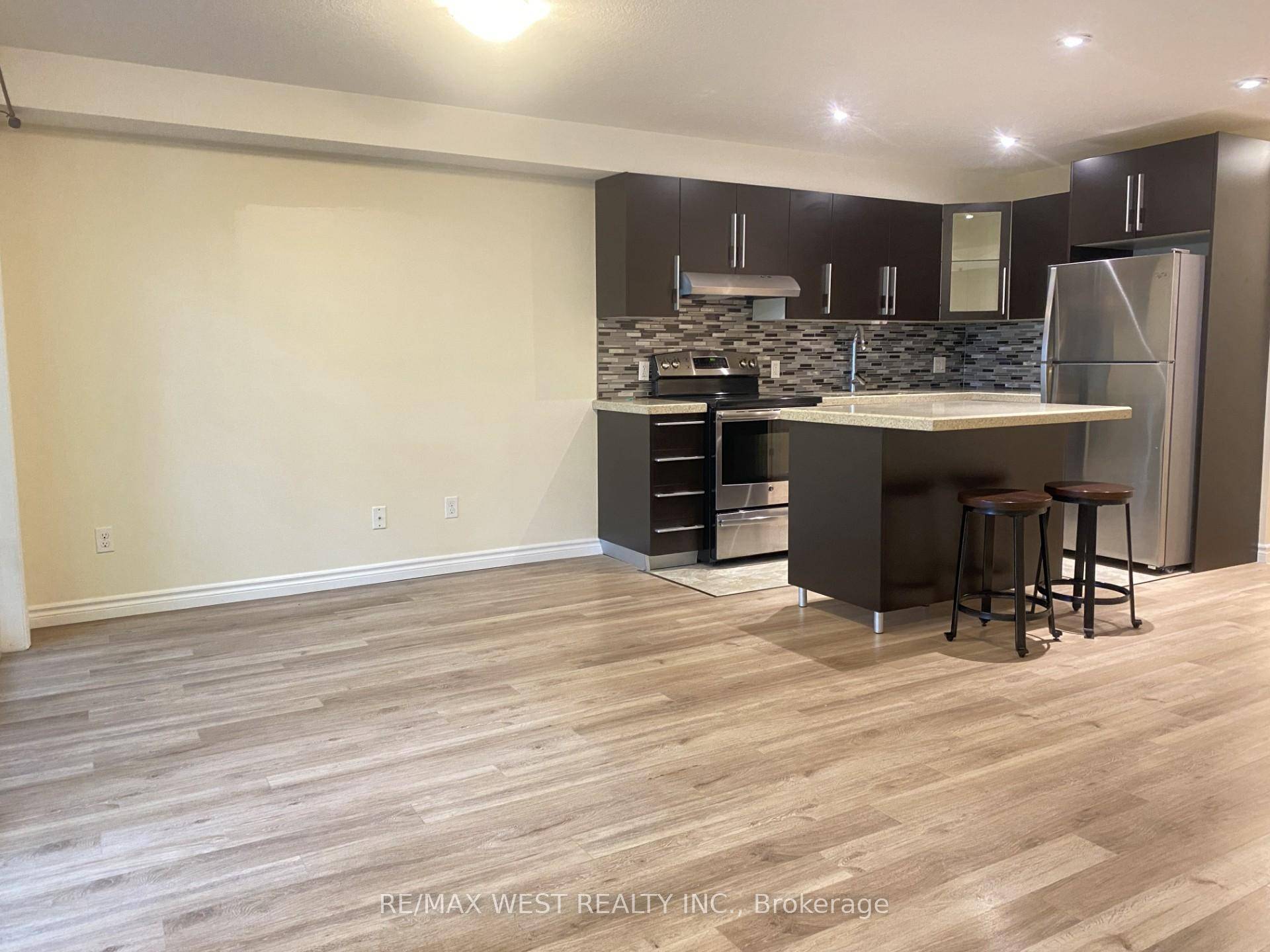 This Stacked Townhouse Offers A Beautiful Open Concept Living Room, Creating A Spacious And Inviting Feel.