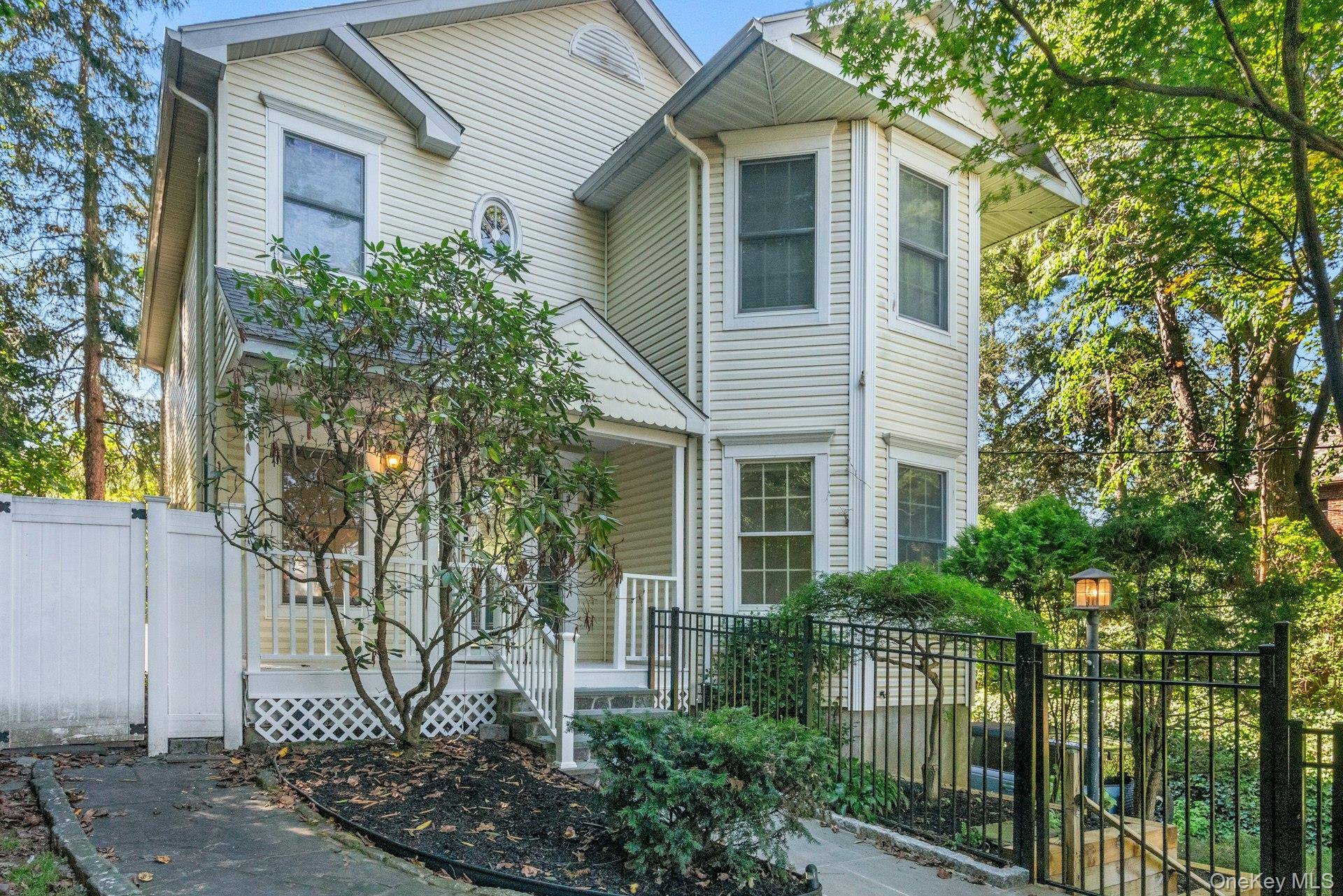 Well maintained Colonial featuring a fully fenced front and backyard, inviting front porch and a freshly painted interior, available for immediate move in.