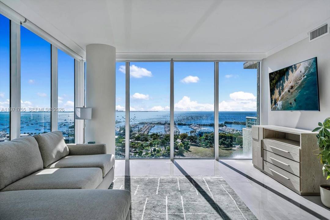 Enjoy living the ultimate Miami lifestyle in this fully renovated, rarely available 01 line corner residence at The Ritz Carlton Residences, featuring stunning endless water views of the bay and ...