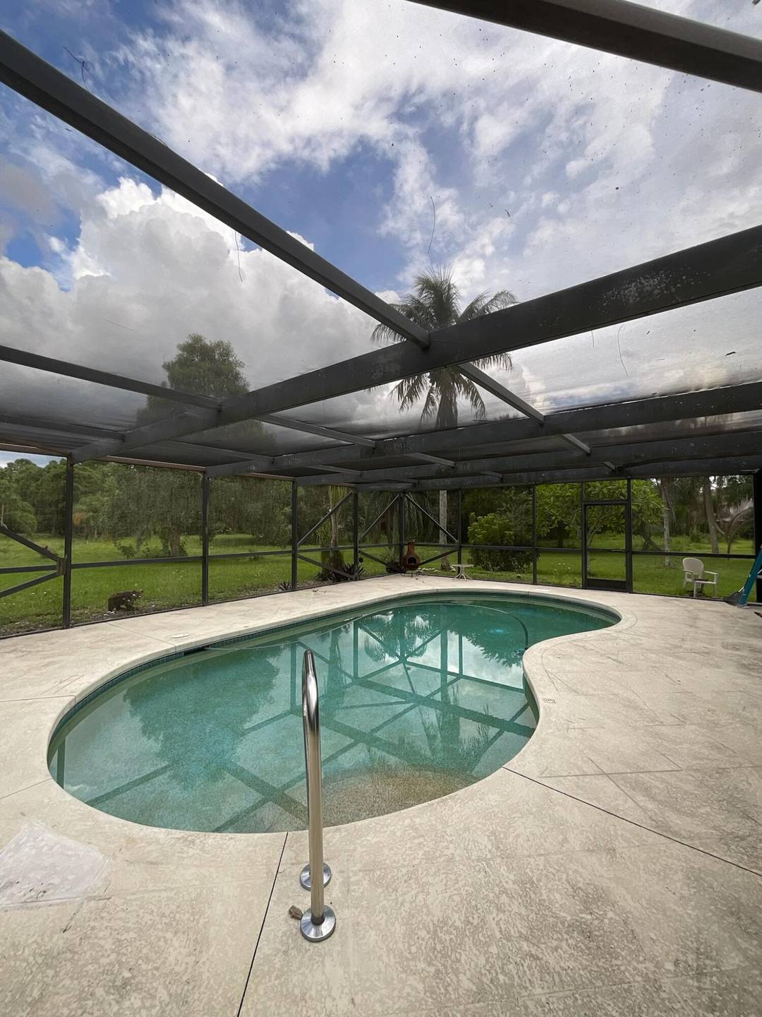 Come see this renovated retreat nestled in the trees of Loxahatchee Groves.