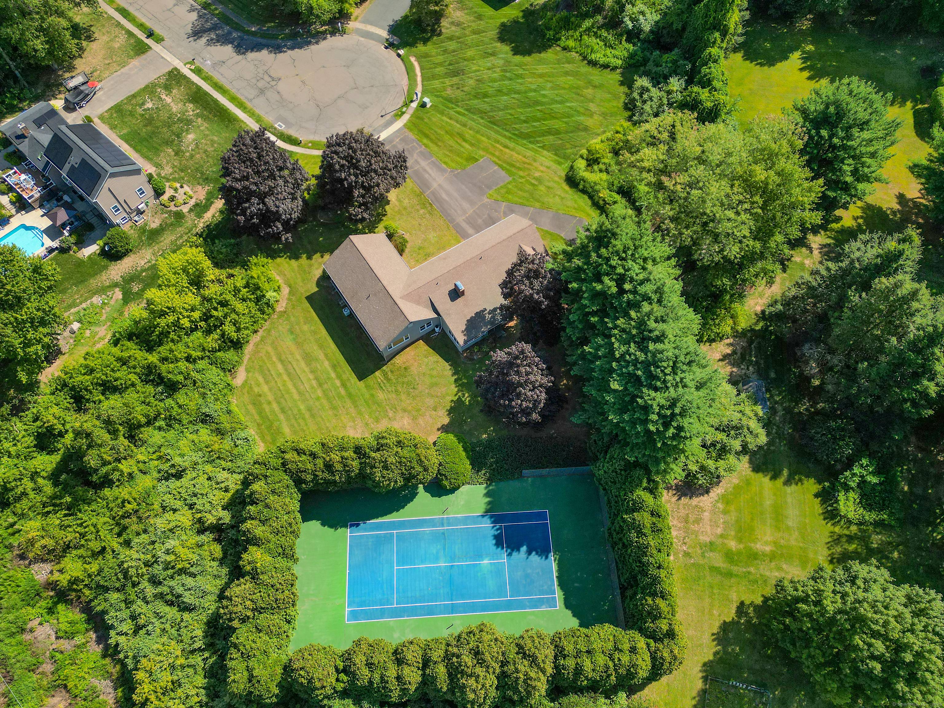 Welcome to this bright and sunny charming 9 room, 3 1 2 bath ranch with 3 car attached garage, set on a oversized 1.
