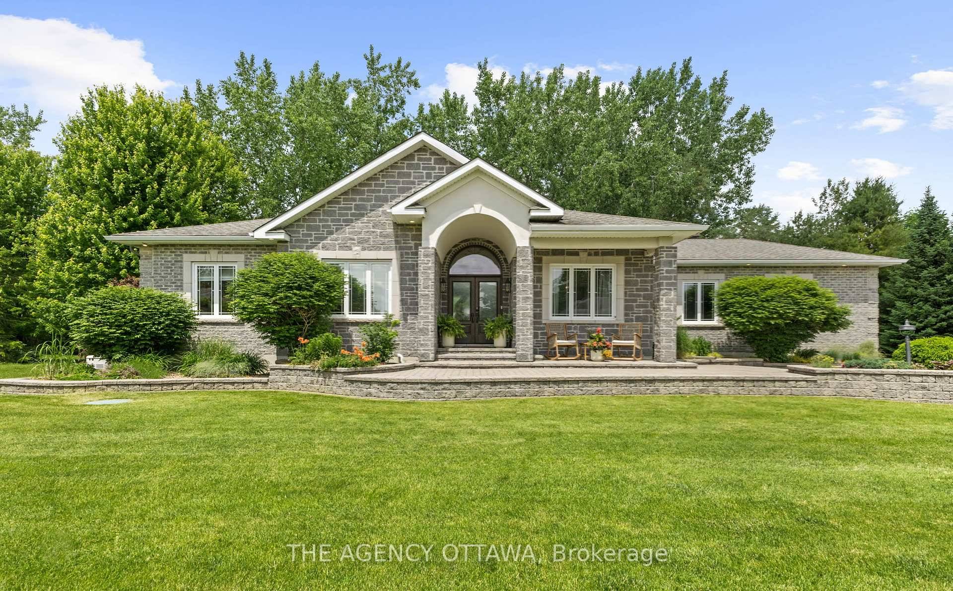 Situated on a private half acre lot, surrounded by mature trees and lush gardens, this exceptionally maintained home offers tranquility and show stopping design.
