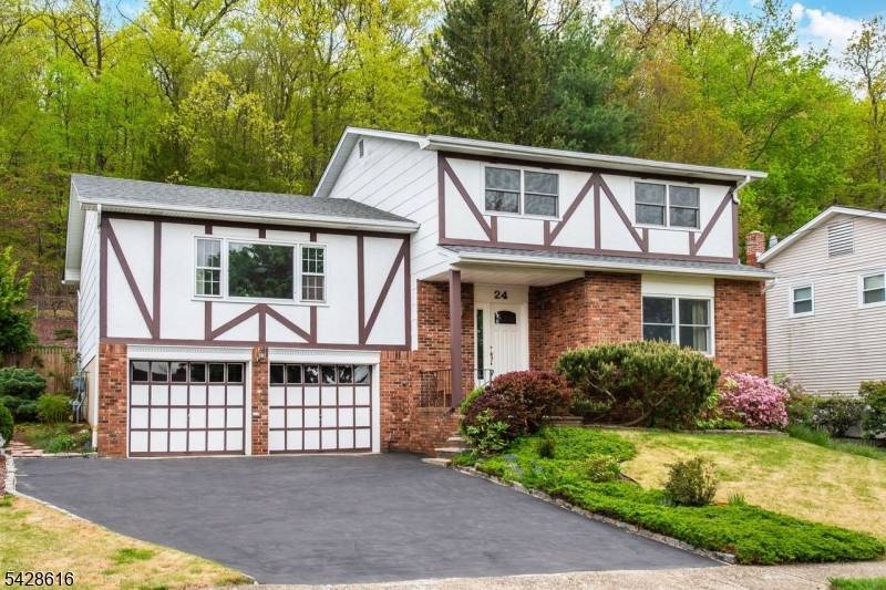 Located on one of the town's most picturesque streets, this sugar maple split level home offers exceptional living space and scenic tranquility.