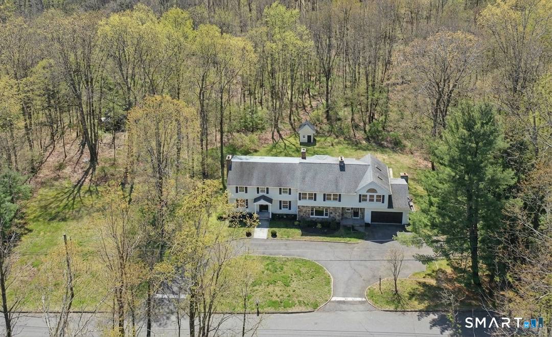 Welcome to this expansive and beautifully updated six bedroom Colonial, offering three full and two half baths and thoughtfully positioned on a sprawling 2.