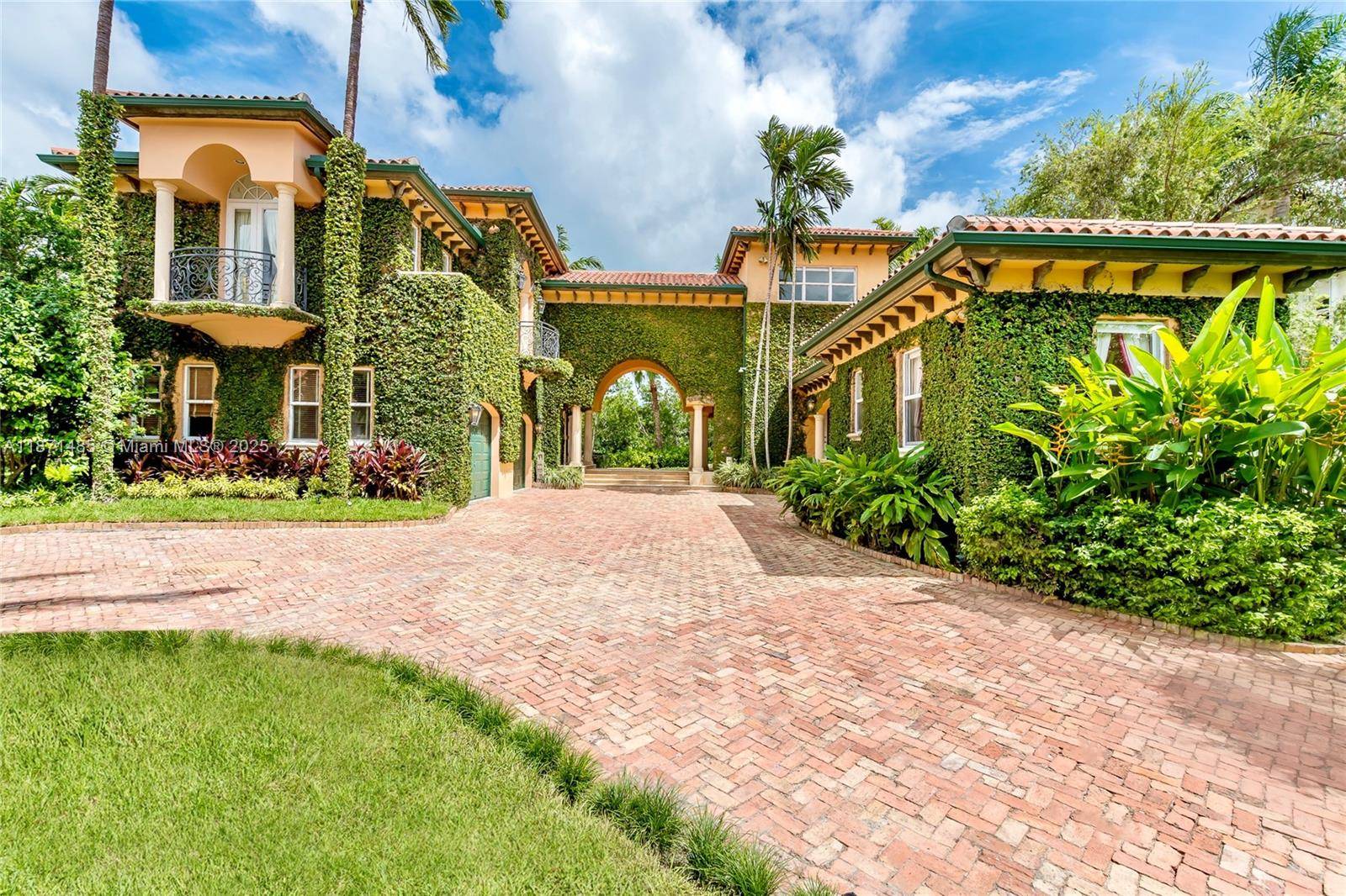 Nestled in the exclusive Islands of Cocoplum community, this stunning waterfront estate offers luxury living at its finest.