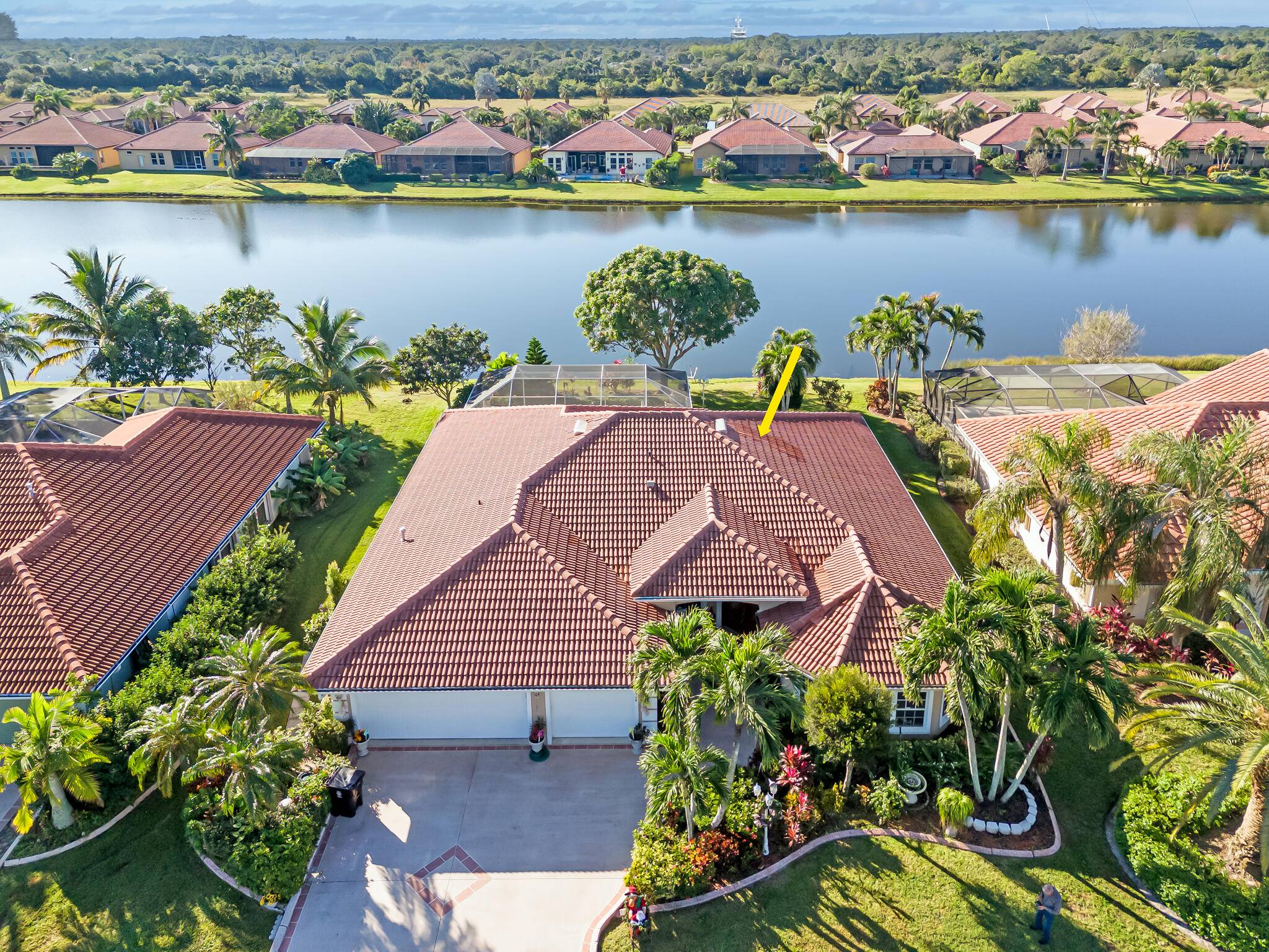 Stunning exquisitely completely remodeled well appointed 3 2 2 lake view executive home with versatile use either office or den in desirable Heatherwood quaint community St Lucie West.