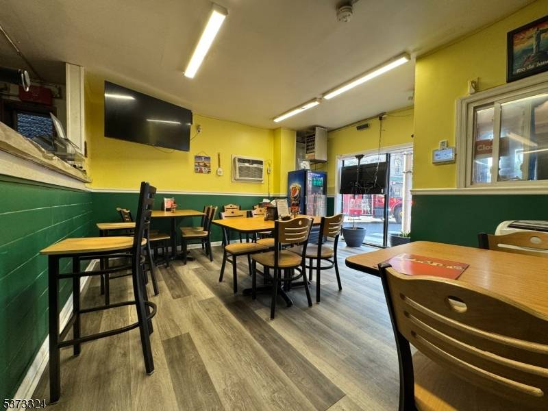 Turn key operation, completely equipped restaurant featuring tables, chairs, pots and pans, dishes, utensils, blenders, coffee maker, soda refrigerators, sandwich stations, commercial stove, cash register, alarm, 1 freezer room and ...