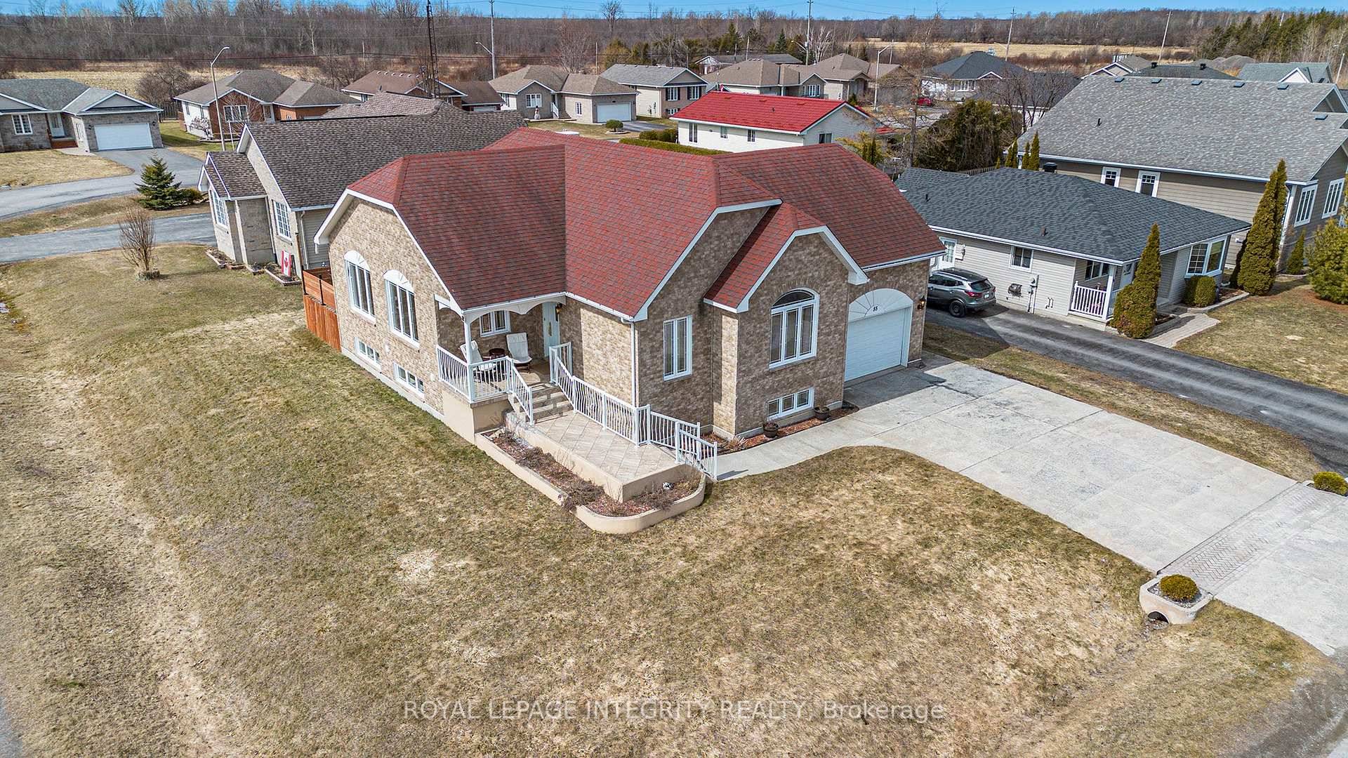 Welcome to 55 Rowan Drive a custom built, all brick executive residence set proudly on a prime corner lot in one of Morrisburg's most sought after neighborhoods.