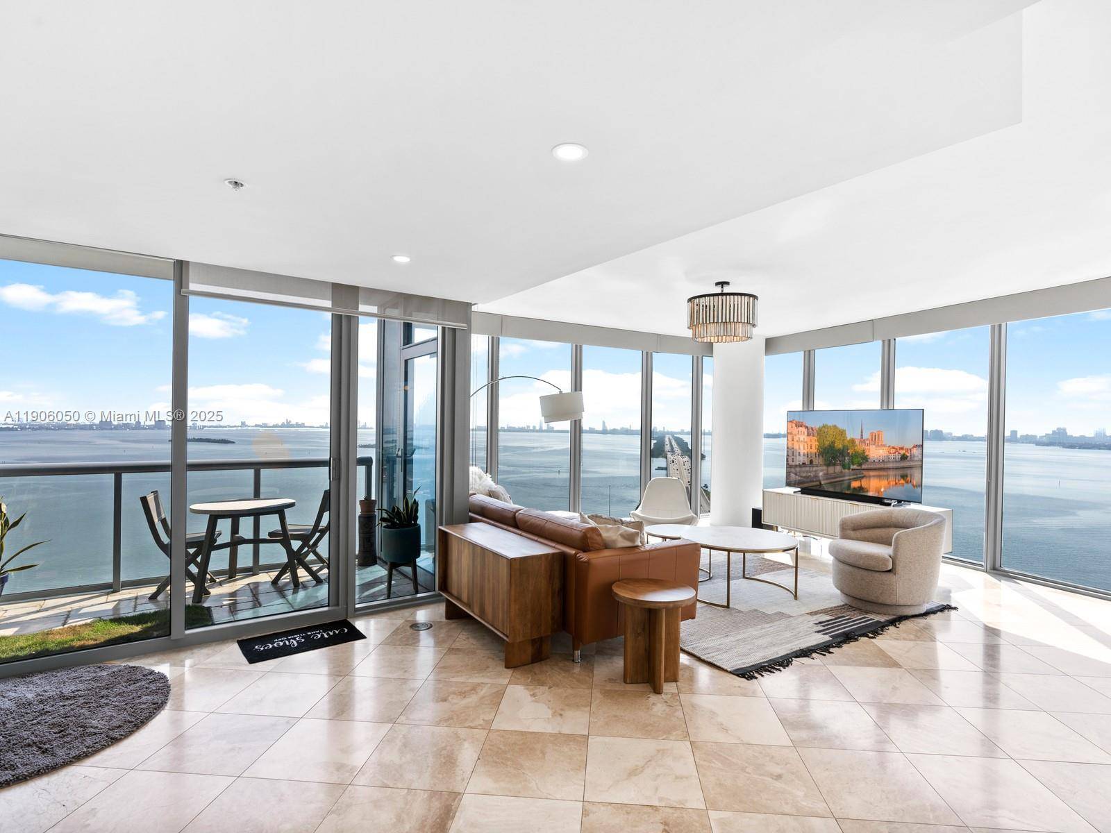 Set on a rare high floor, Unit 2312 captures 180 degrees of unobstructed water views.
