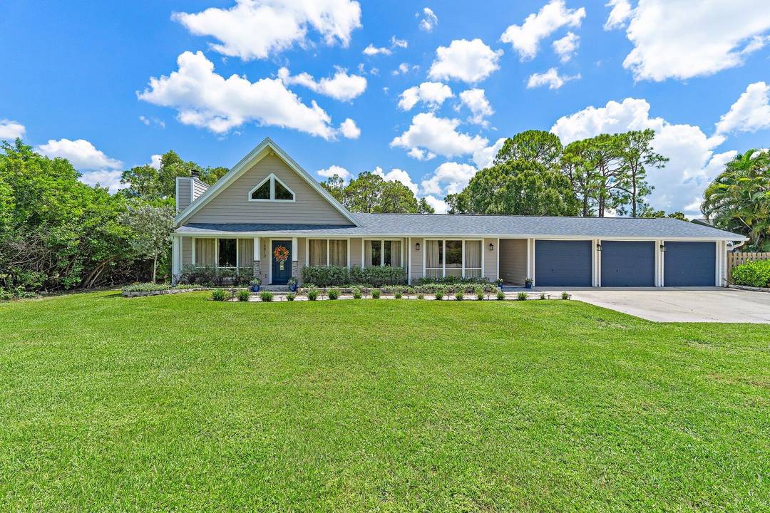 Discover Jupiter Farms living in this updated 3BR 3BA pool home on 1.