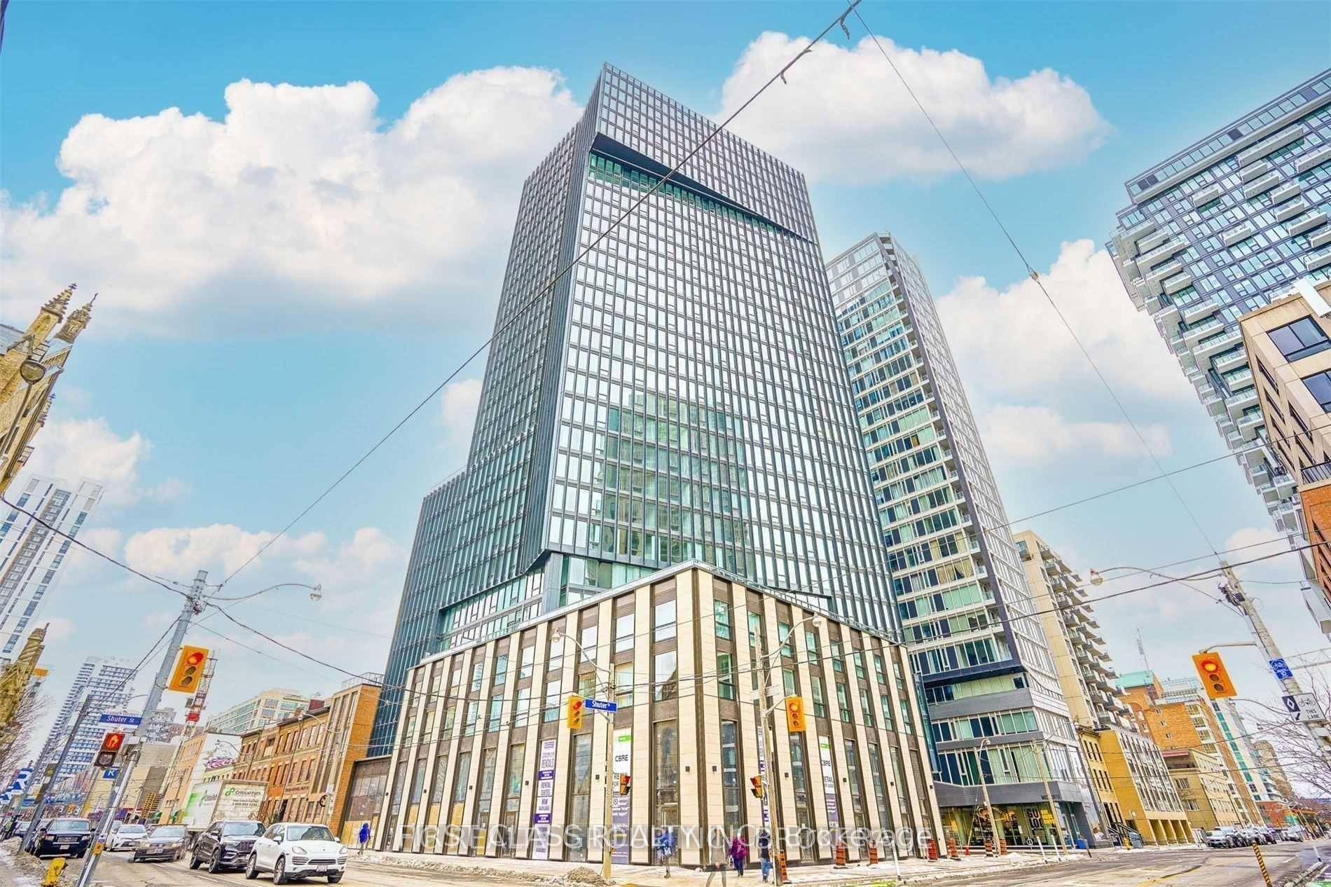 Spacious 1 Bedroom Den Corner Unit At Fleur Condos By Menkes, Featuring A Functional Open Concept Layout With Modern Kitchen And Built In Appliances.