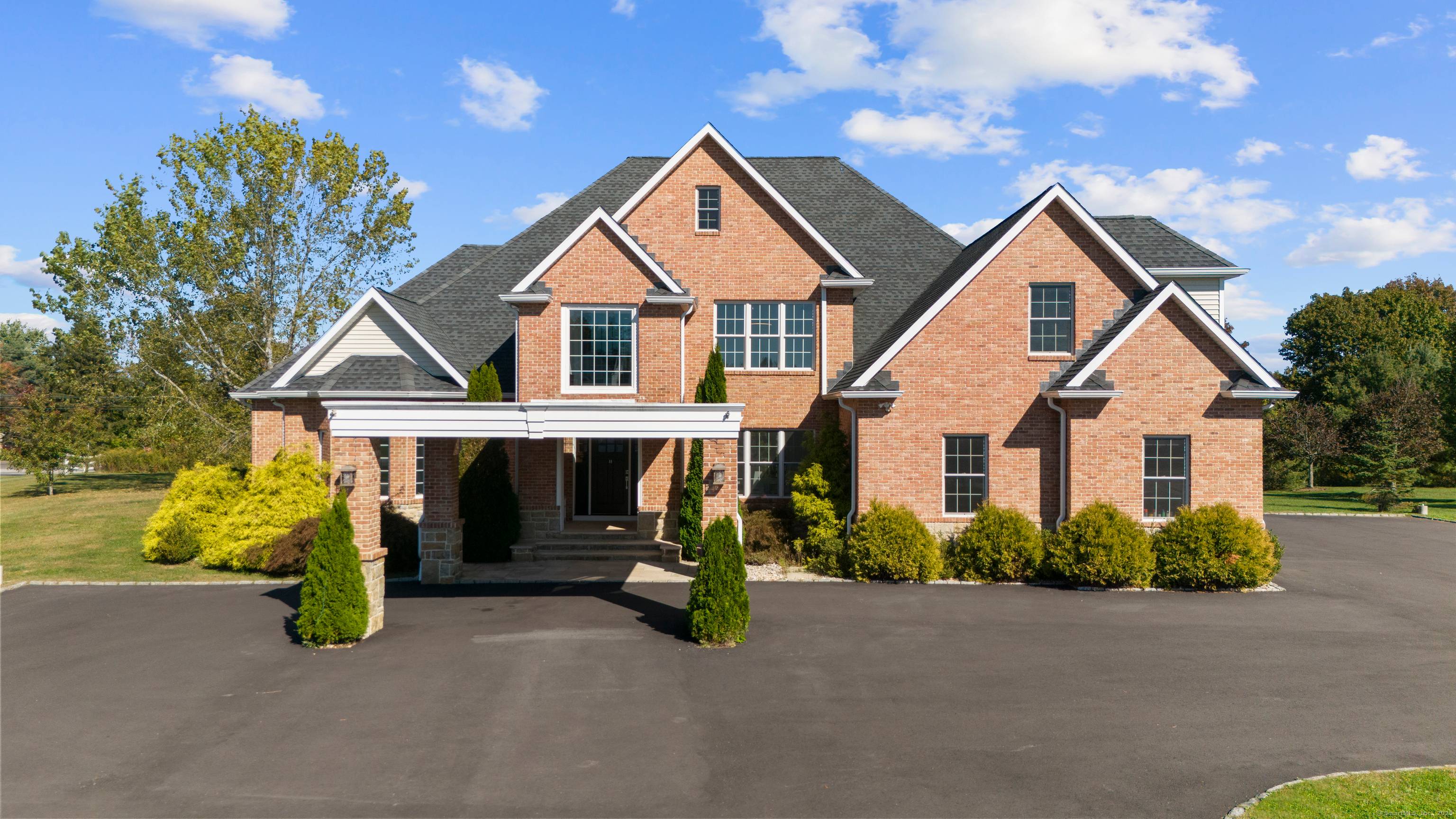 Experience refined living in this custom built, modern minimalist brick colonial, where timeless architecture meets fresh, contemporary design.