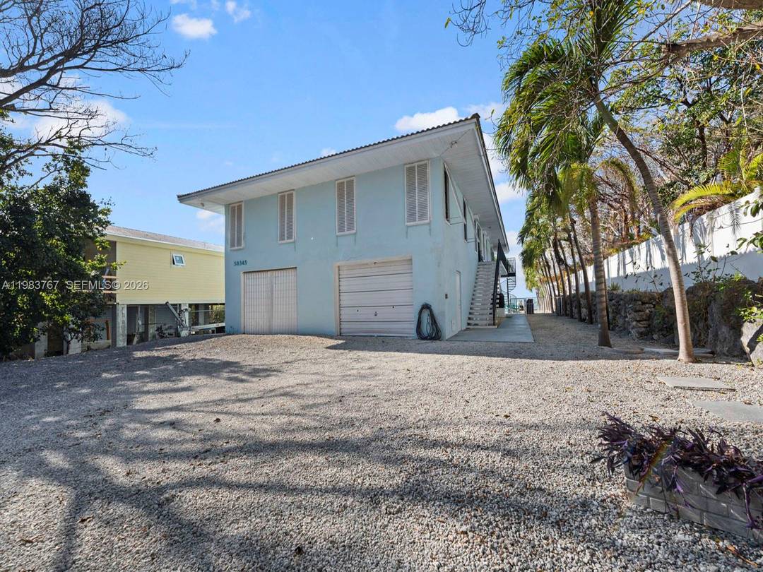 Stunning 3 bedroom, 3 bathroom home in Grassy Key, featuring a deep water dock with easy access to the ocean, just a short ride away from its Gulf side location.