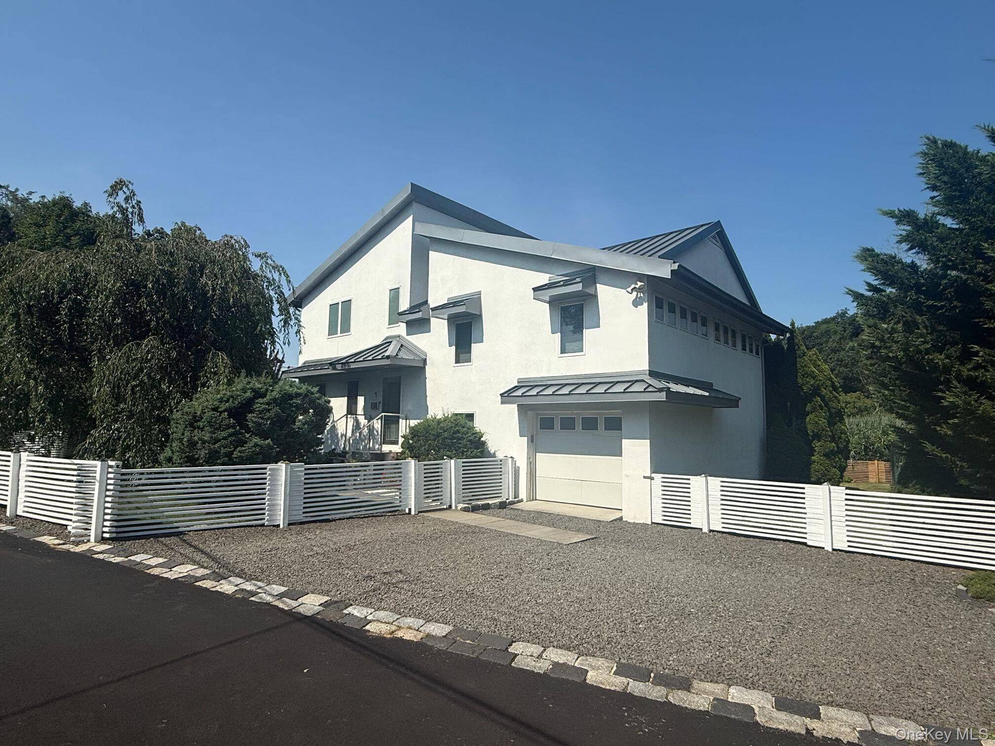 Perfectly located on a cul de sac in walking distance to town, beach and train, this attractive 4 bedroom 3 bath home offers a modern, European design and unique features.