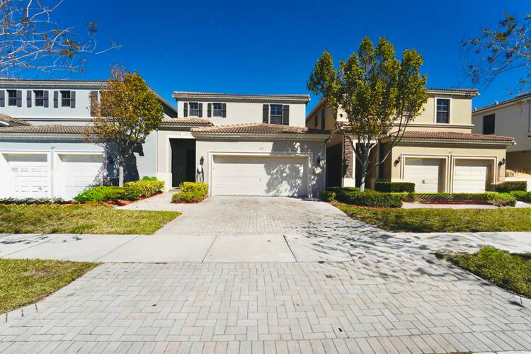 This professionally remodeled two story lakefront residence sits in a secure, highly sought after gated community, Aventura Isles in Miami.