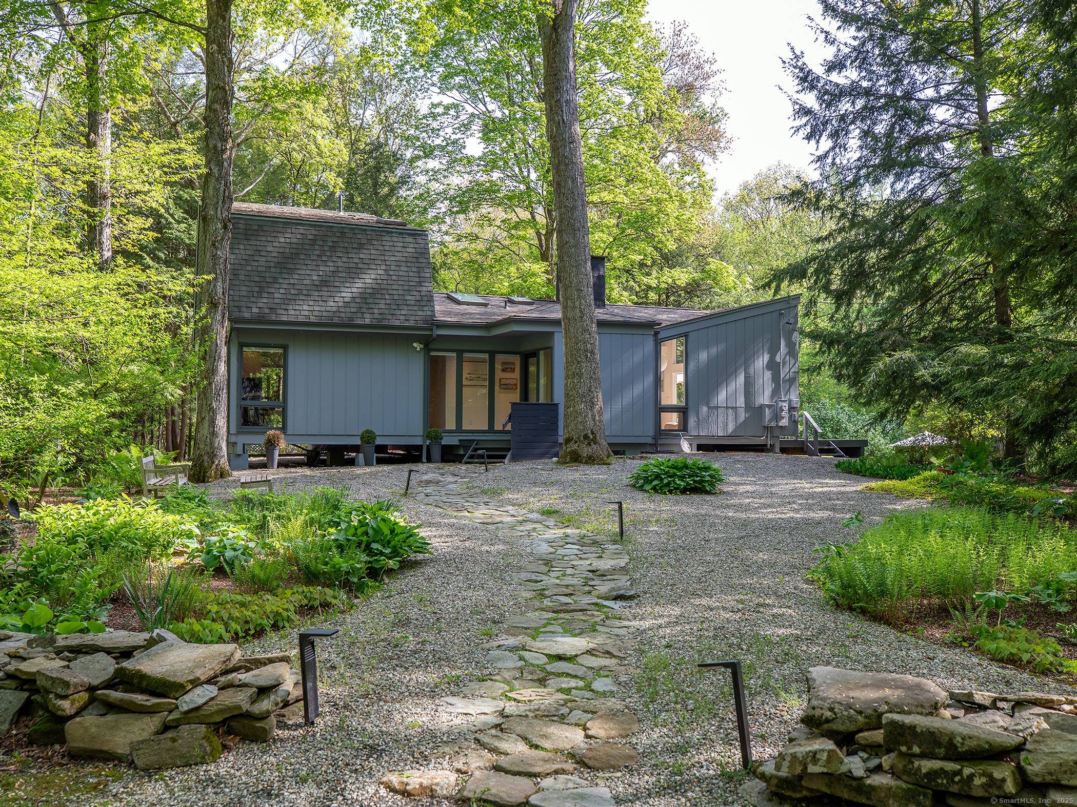 Step into timeless style and serene privacy with this beautifully maintained 1966 mid century modern home.