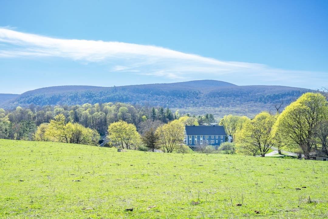 The post and beam residence showcases soaring ceilings and expansive windows that frame the spectacular landscape while highlighting the architectural character throughout.