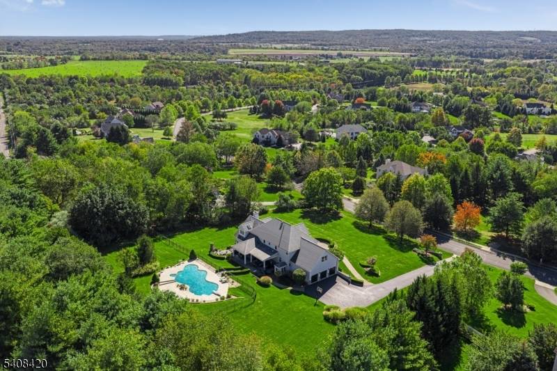 Proudly situated on 1. 75 acres in Pleasant Run Estates, this beautifully updated Colonial style residence offers a blend of unparalleled sophistication and modern luxury.