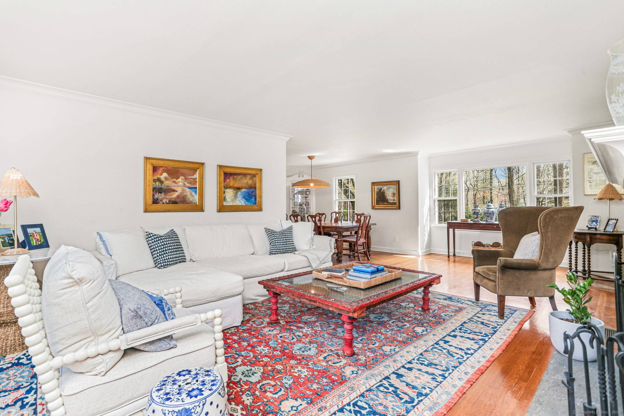 Classic charm meets modern living in this updated colonial, set on over an acre with a stunning wood roof, stone walls, and a circular driveway.