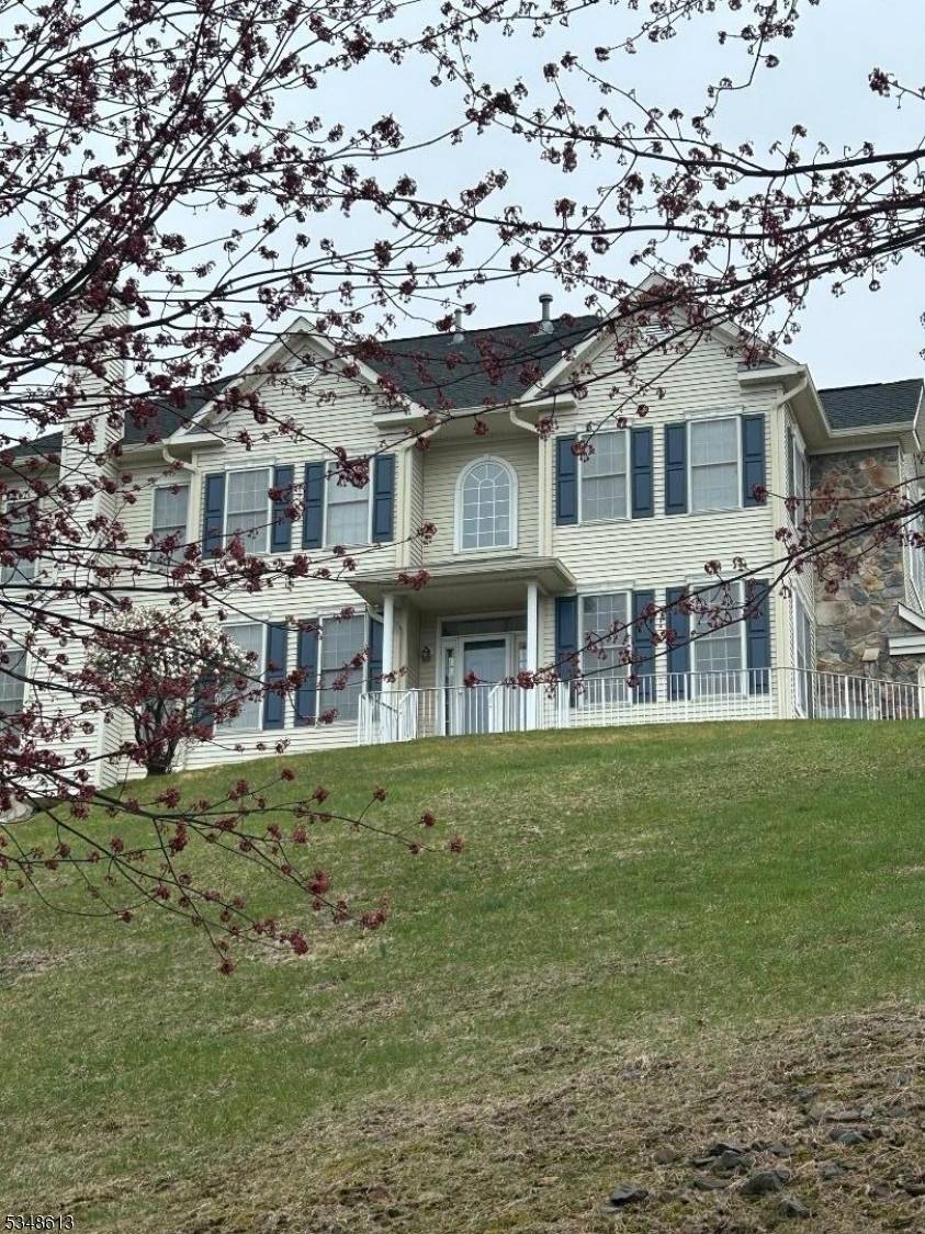 Perched high above the private ROLLING VIEWS community, this exceptional townhome offers refined living with breathtaking panoramic views from every room.