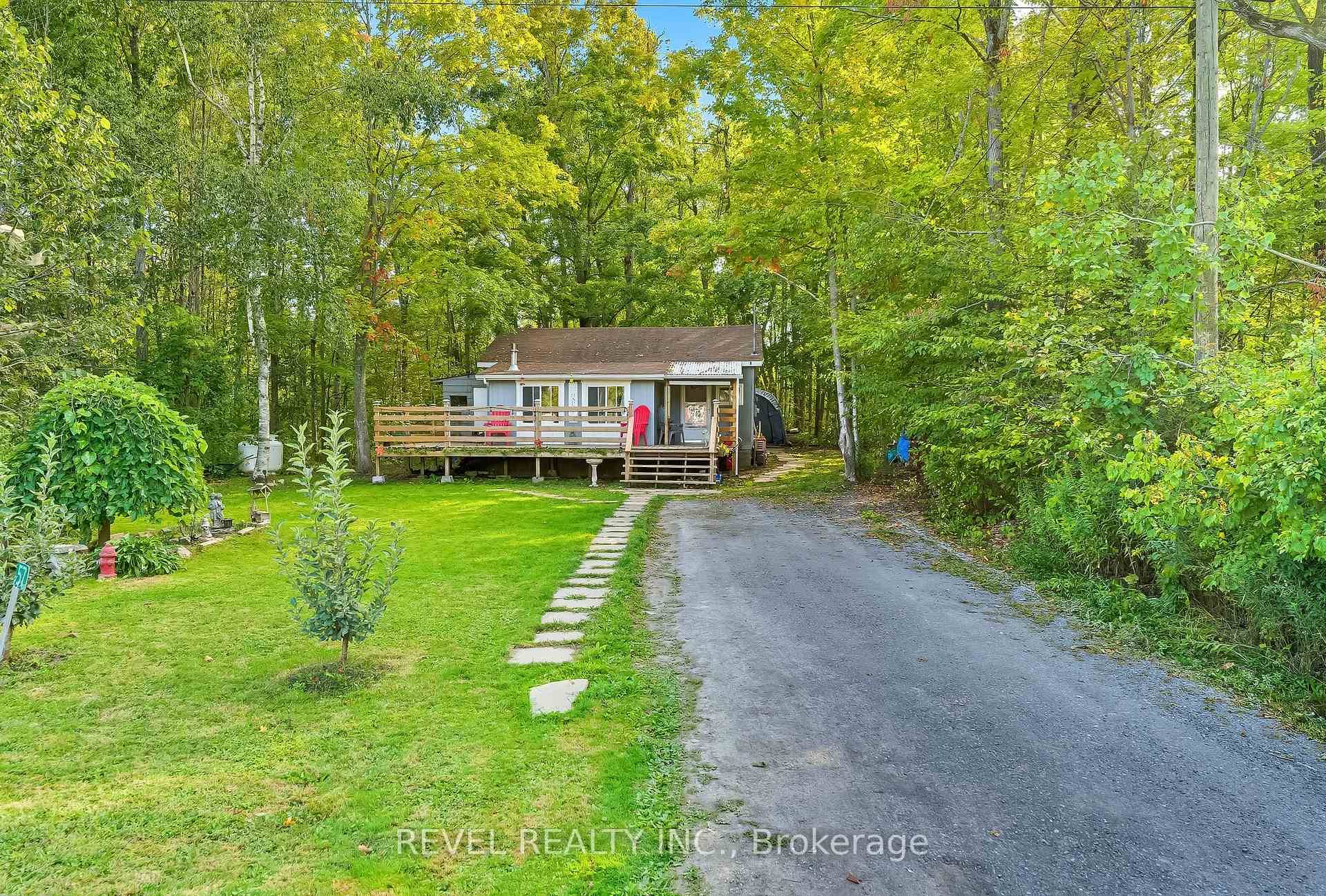 Step into comfort and convenience with this charming home nestled on a spacious, private, well treed country lot.